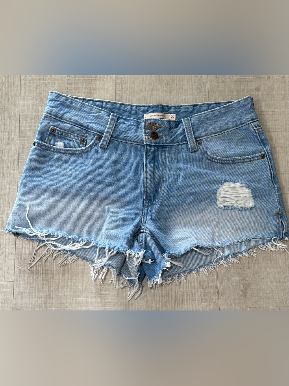 Levi's Superlow Distressed Denim Shorts Size 29 Light Wash Raw Hem Y2k low rise